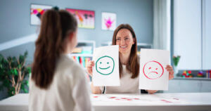 Image showing an expert helping a young child overcome emotional challenges and ADHD struggles during an ADHD assessment.