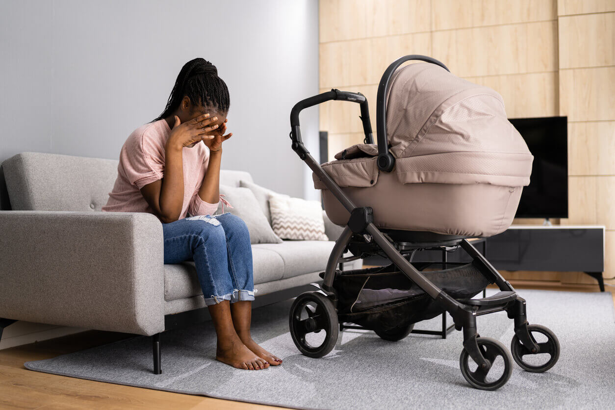 Depressed Unhappy African American Woman With Newborn Is Going Through Postpartum Depression.